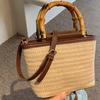 Niche Design Retro Handheld Straw Bag for Women New Fashionable Versatile Shoulder Crossbody Bag Woven Bucket Bag
