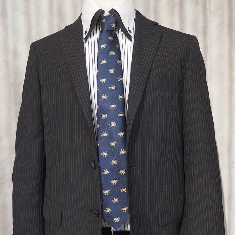 A unique tie featuring a row of [CUFFSMANIA] fun, crabs.