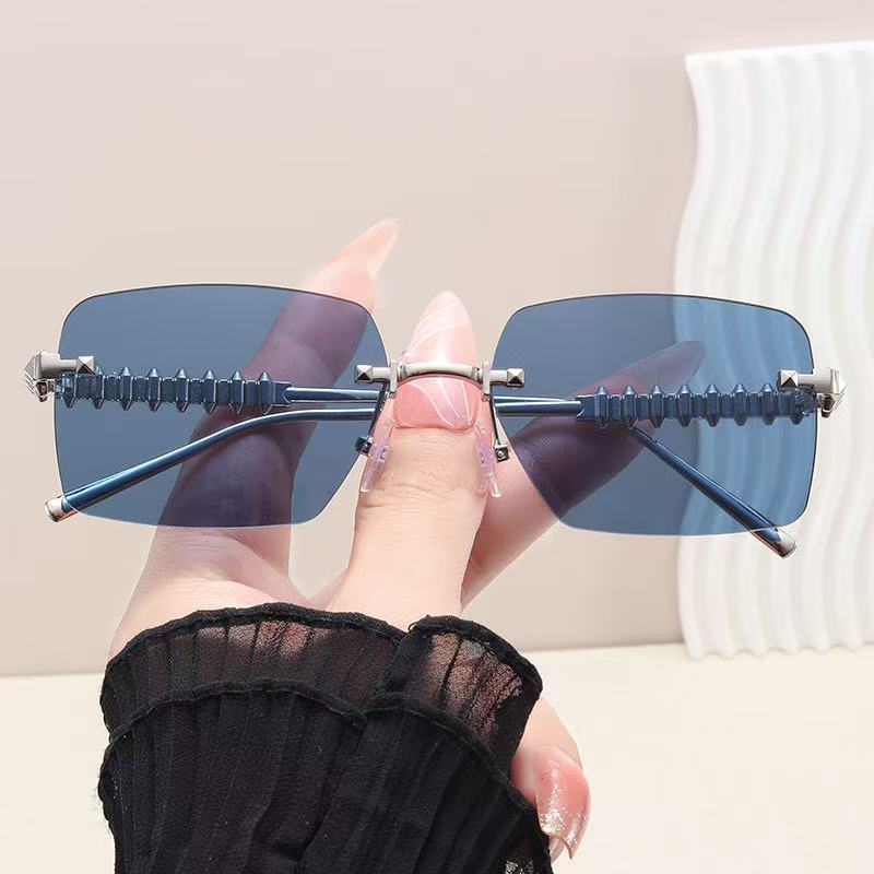 New frameless premium metal rivet leg sunglasses fashionable vacation driving sunscreen women's sunglasses