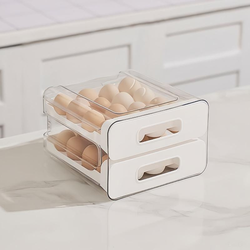 Double-layer 32-grid drawer-style egg storage box made of PET and PP. Space-saving fridge organizer keeps eggs fresh and neatly arranged.