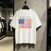 Футболка Rhude с принтом флага США Унисекс Унисекс Американский стритвир Высококачественные Свободные Футболки с коротким рукавом Топы 2026 Летние Футболки Удобные