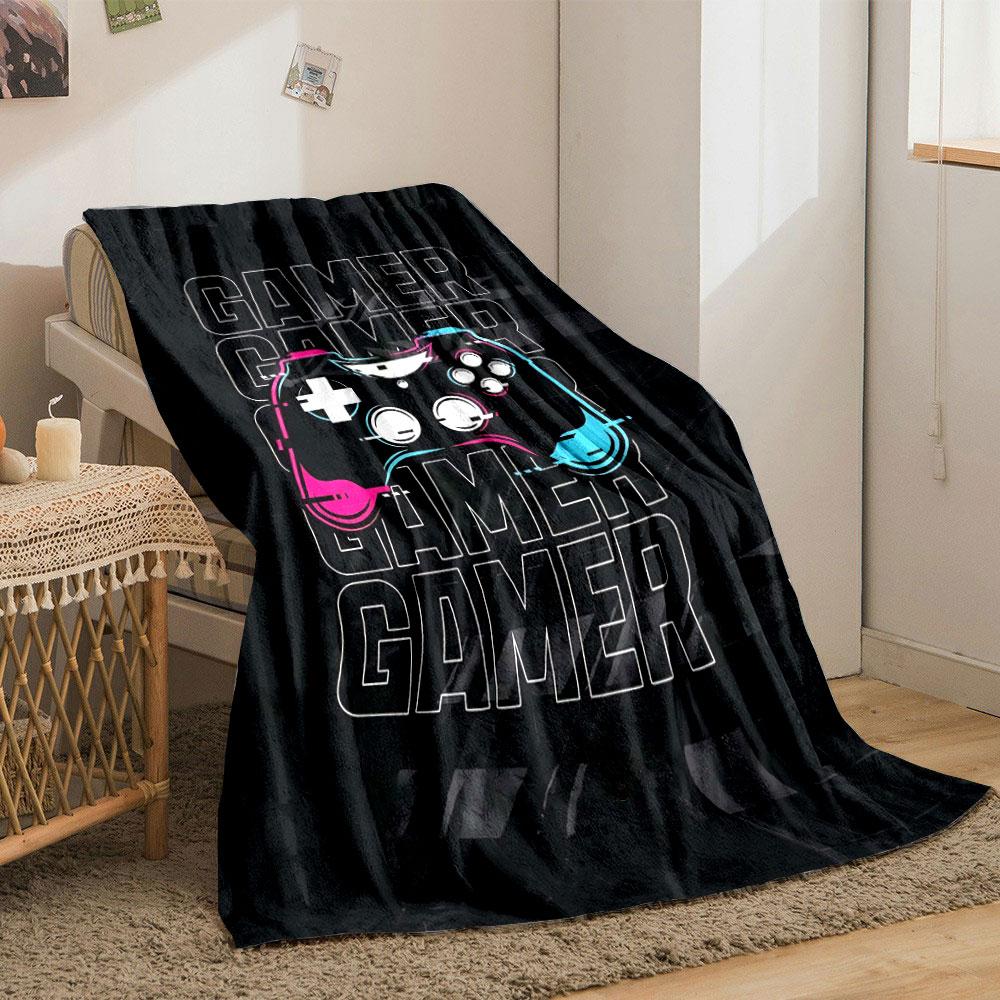A colorful game controller over repeated "GAMER" text on a dark background. for all seasons blanket lunch break throw gift