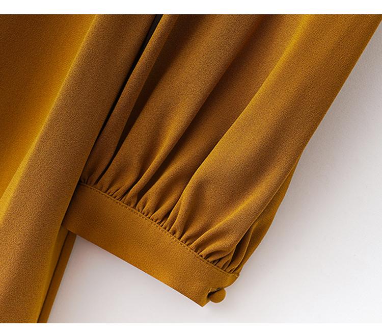 Waist cinching temperament long sleeved mid length skirt