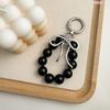 Korean Style Keychain Pendant: Metal Irregular Bow with Pearl Beads for Phone or Bag Accessories