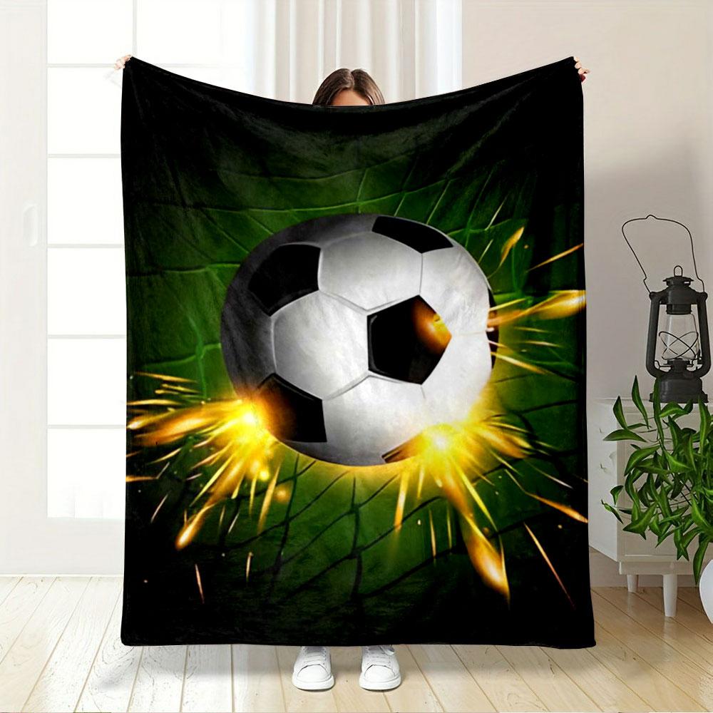 A soccer ball hitting a green net with bright orange sparks. for all seasons blanket lunch break throw gift