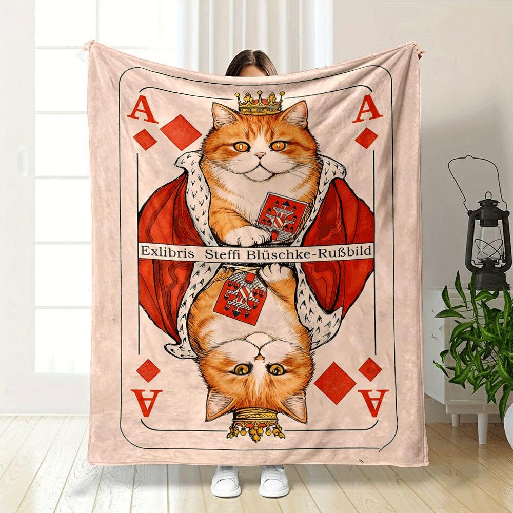 A crowned orange cat in royal attire mirrored on a playing card design. for all seasons blanket lunch break throw gift