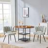Table and chair set. Round 107 cm dining table in walnut look, double storage + 2 cream-grey fabric chairs with flower-shaped backrest made of bouclé.