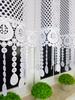 A short mesh curtain decorated with guipure lace