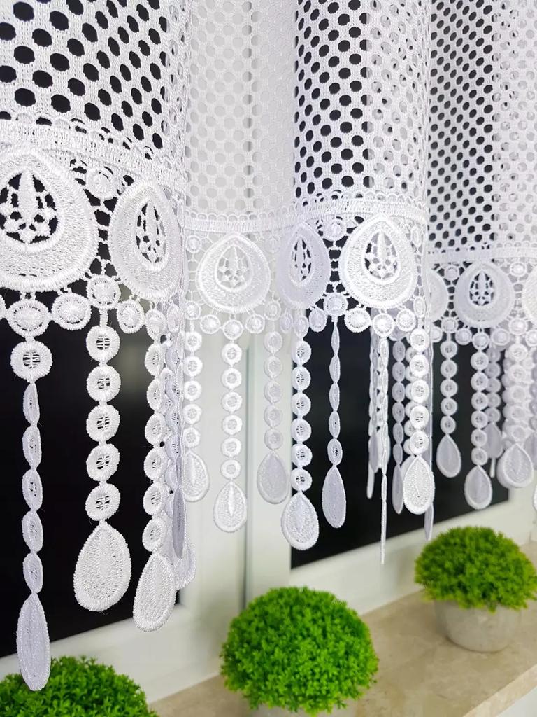 A short mesh curtain decorated with guipure lace