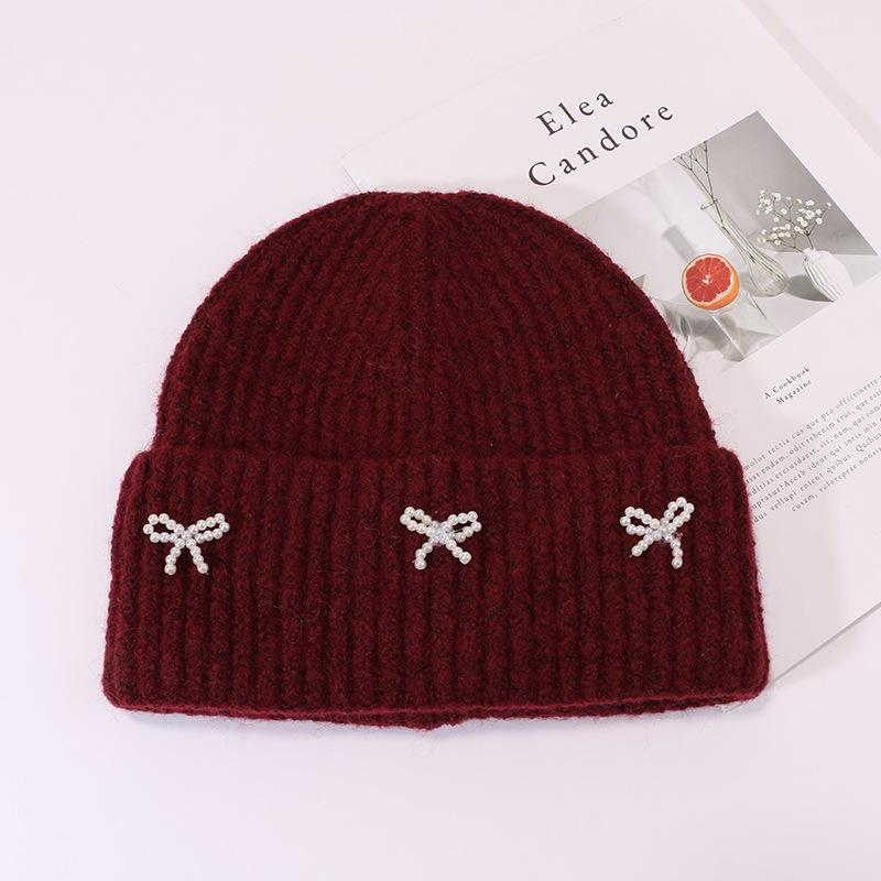 Small pearl knot knitted hat Korean version casual versatile face small winter warm hat