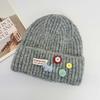 Age-reducing button wool hat Women's autumn and winter face is small and versatile knitted hat Big head circumference thermal ear protection hat