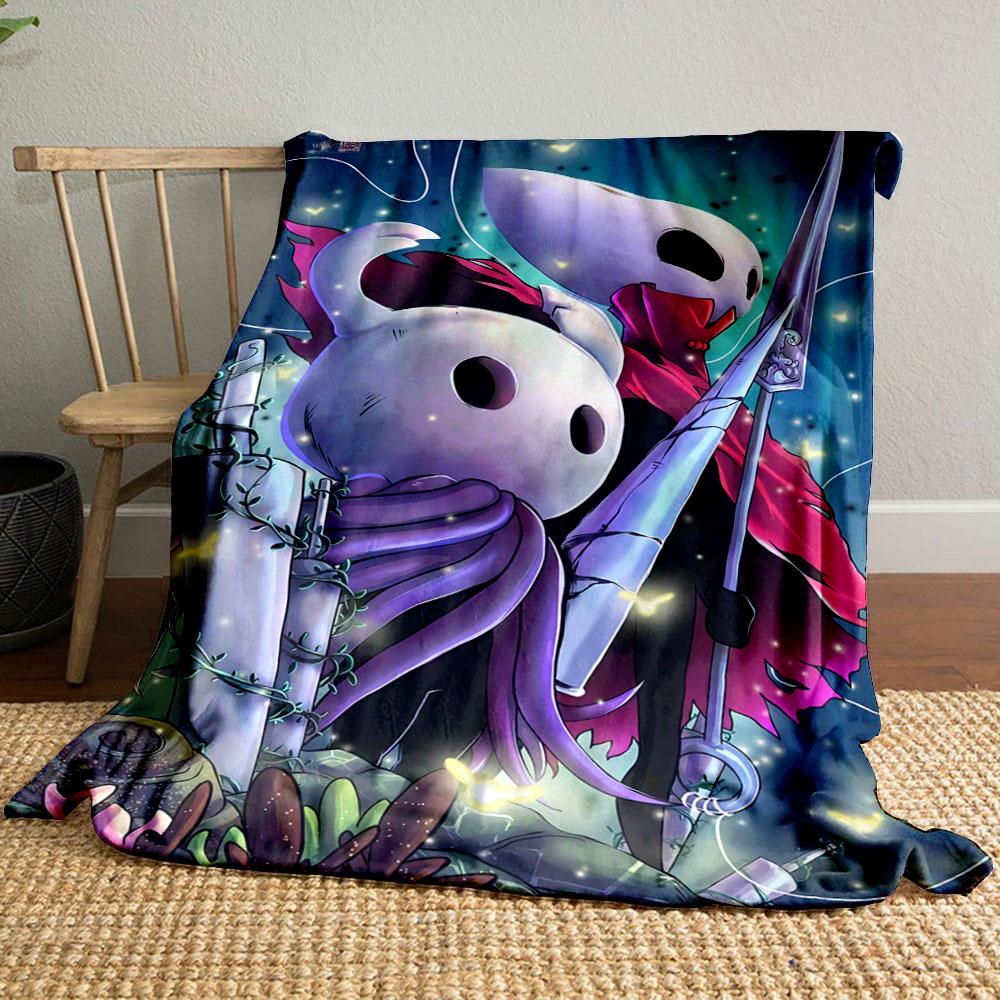 Two stylized characters with white masks, cloaks, and glowing background. for all seasons blanket lunch break throw gift