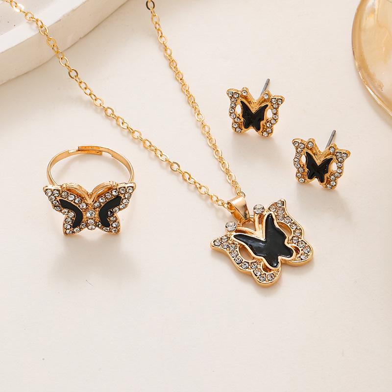 Shein Trendy Butterfly Jewelry Set: High-End Diamond Hollow Necklace, Ring & Earrings for Women - European & American Fashion.