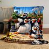Animated penguins with tools and snacks in front of a zoo and city skyline. for all seasons blanket lunch break throw gift