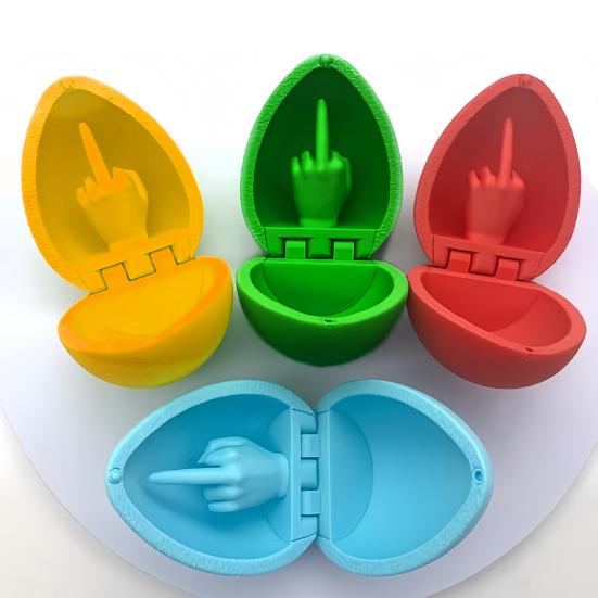 3D-печатная игрушка в виде яйца со средним пальцем. Цветное пасхальное яйцо со средним пальцем.