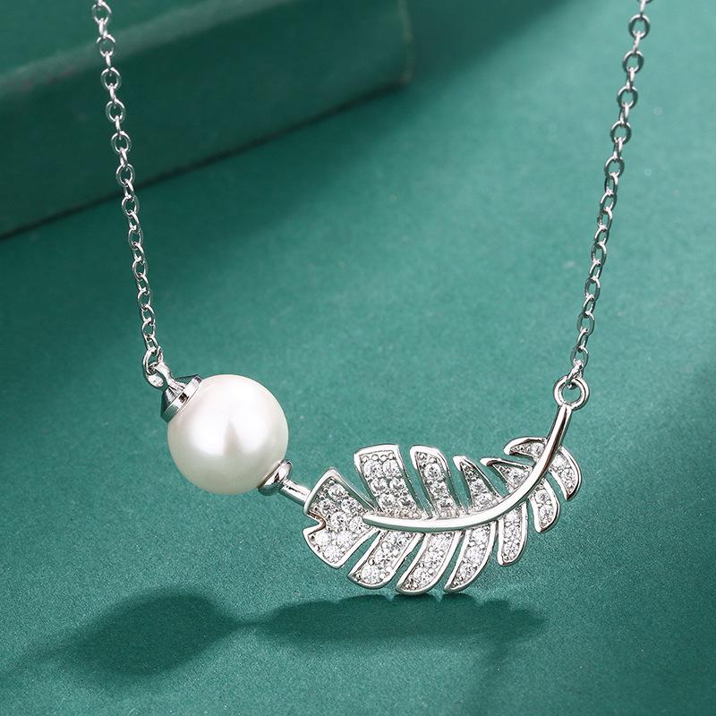 Jewelry imitation pearl pendant S111 silver needle feather pearl stud earrings European and American luxury zircon ring jewelry women's
