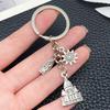 Ancient Silver Castle Sun Statue Zinc Alloy Keychain - Creative Backpack Accessory and Commemorative Pendant.