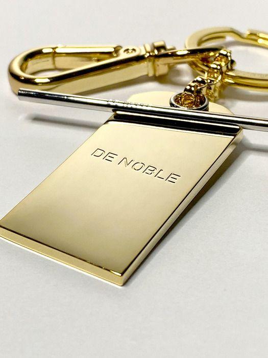 DE NOBLE THE LABEL Брелок с зеркальной биркой