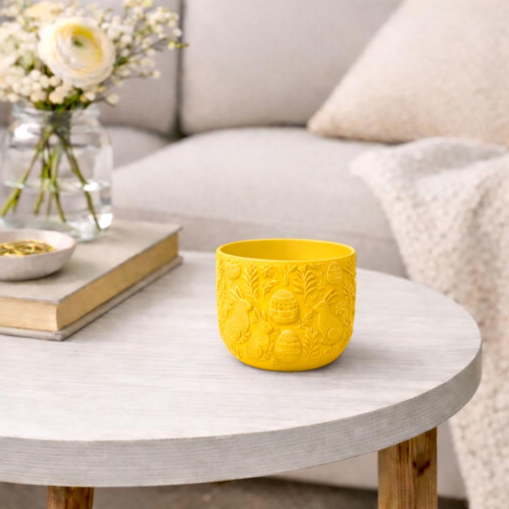 Yellow Easter flowerpot with rabbits, decorative spring cover
