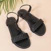 Женские повседневные сандалии на плоской подошве с плетеным дизайном, популярная черная удобная обувь, сандалии с ремешками, подходят для повседневной носки.