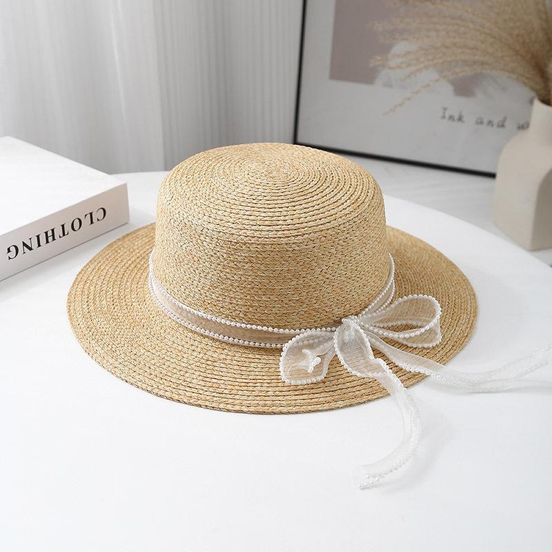 New French Lafite Sweet Bow Straw Hat Women's Spring Summer Simple Sunscreen Breathable Sunshade Elegant Flat Top Hat