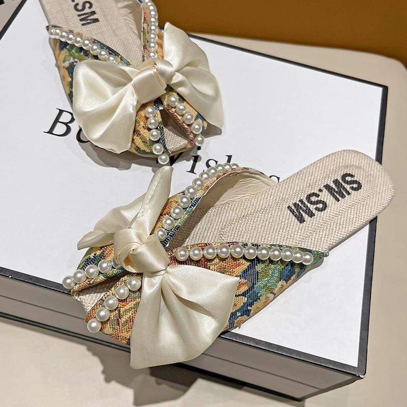 Модные летние новые шлепанцы Baotou Womenr 2025 на плоской подошве с бантом, мягкой подошвой, прохладные шлепанцы, модная женская обувь, домашние шлепанцы