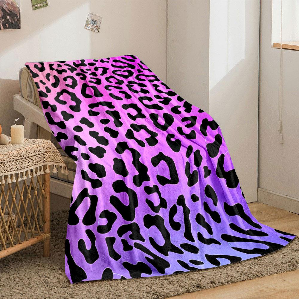 Leopard print pattern on a pink and purple gradient background. for all seasons blanket lunch break throw gift