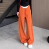 Спортивные брюки в гонконгском стиле оранжевого цвета с широкими штанинами и завязками на поясе