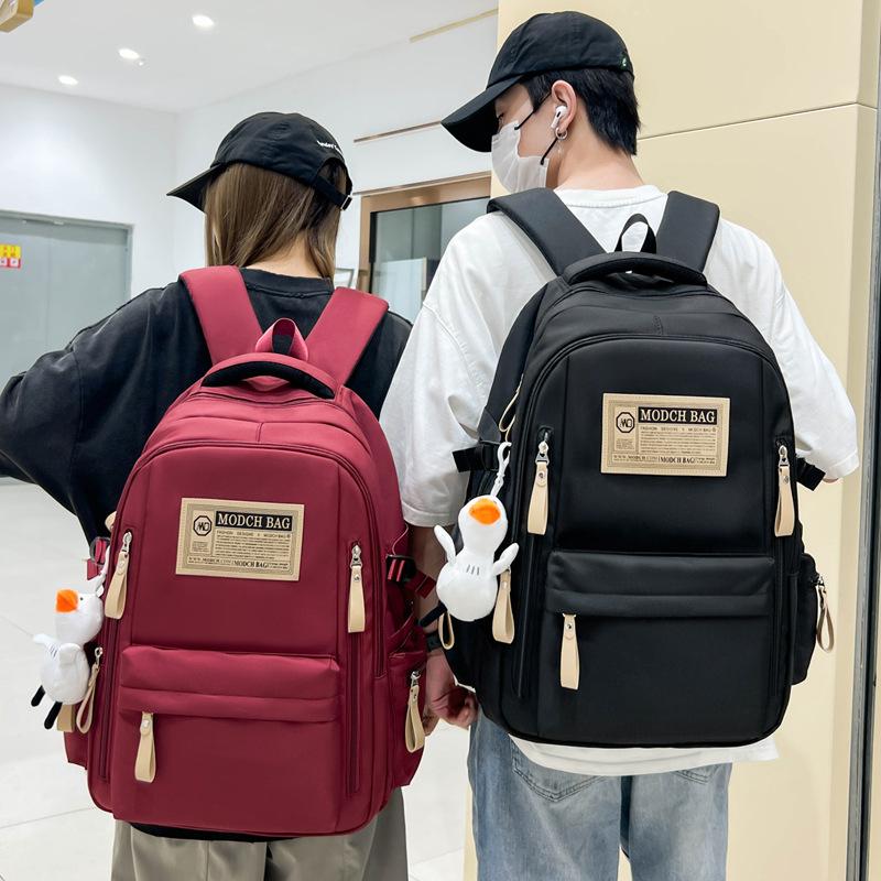 Schoolbag is specially designed for new schoolbags, female students, nylon retro simple, junior high school students, male large-capacity couple .