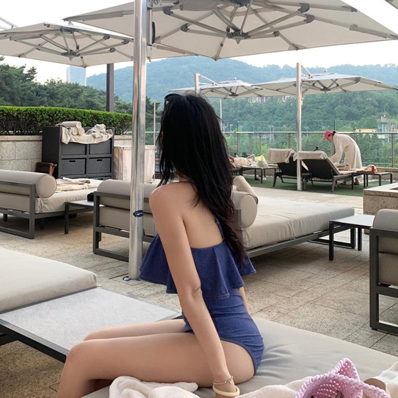 A one-piece triangular swimsuit for women, sexy one-word shoulder ruffle edge, slim and thin, small-breasted vacation swimsuit.