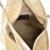A neat, light gold leather backpack