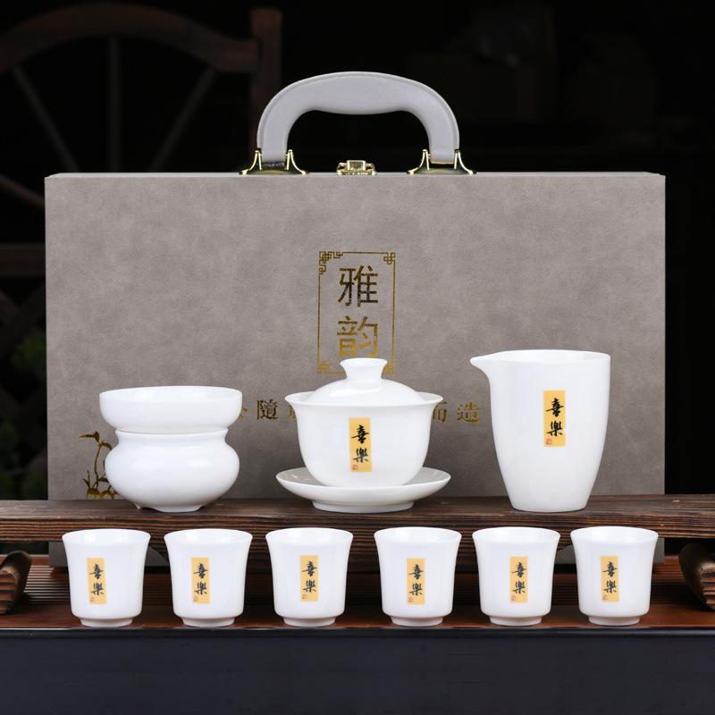 Dehua suet jade kung fu tea set, white porcelain cover bowl painted gold tea cup, the whole set of company opening activities