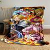 Characters in dynamic poses surrounded by flames and action effects. for all seasons blanket lunch break throw gift