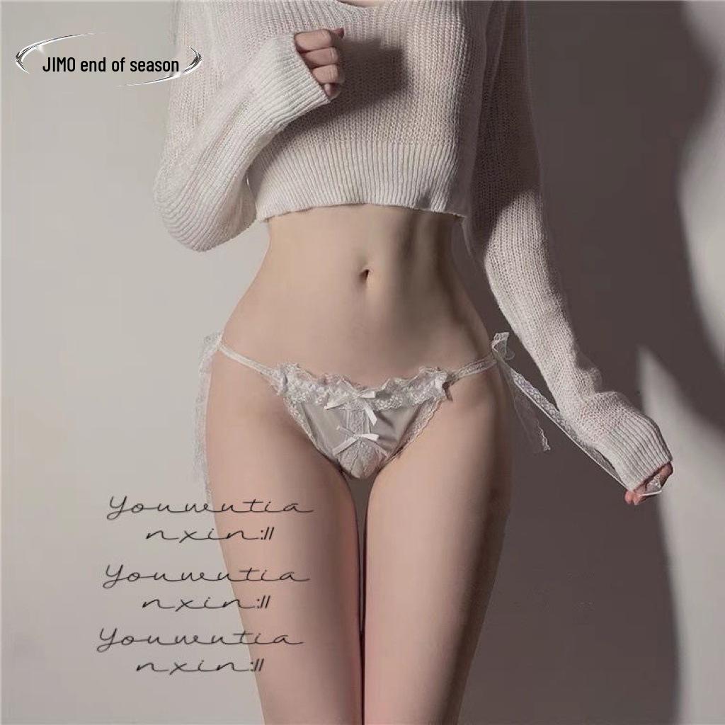 Прозрачное кружевное белье-стринги с бантиком на шнуровке и открытой ластовицей