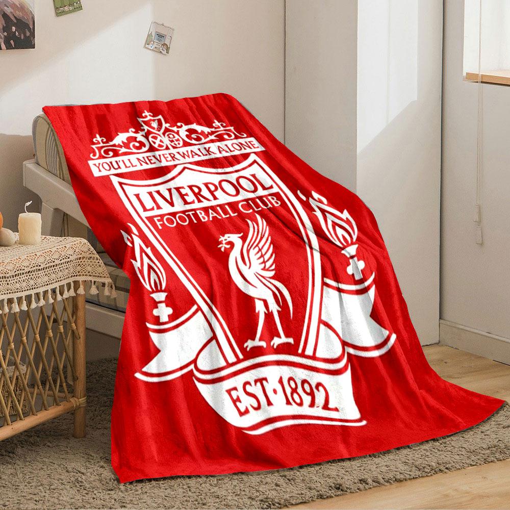 A red shield with white text, a Liver bird, torches, and ornate details. for all seasons blanket lunch break throw gift