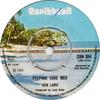 7-дюймовая пластинка KEN LARU - Peeping Juke Box CBN304 Карибская 1976 Великобритания Регги, Ска и Даб Б/У