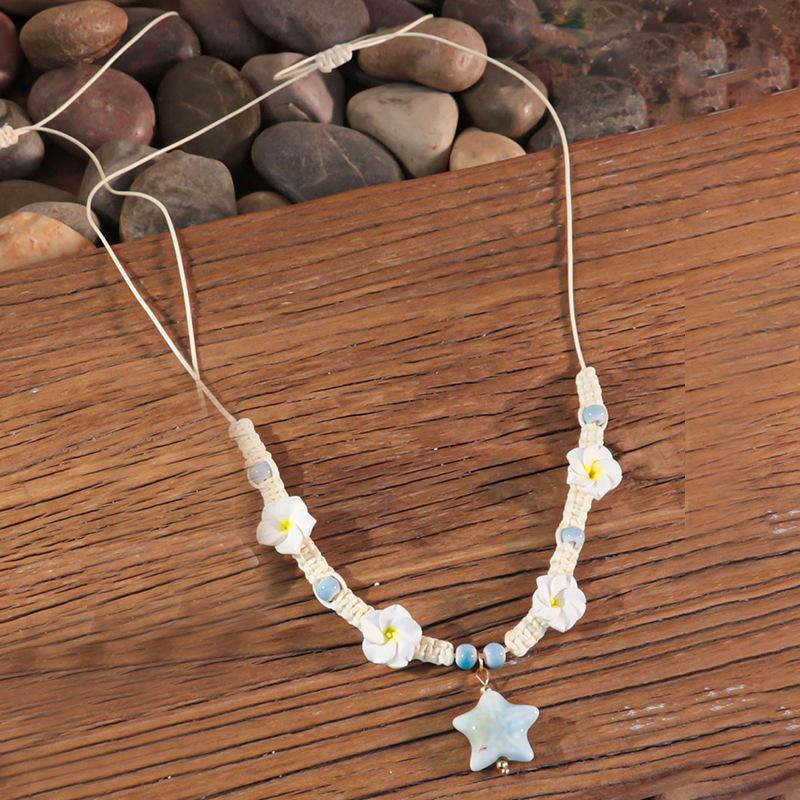 Bohemian vacation style egg flower necklace earrings set ins niche flower soft pottery color collarbone chain tide