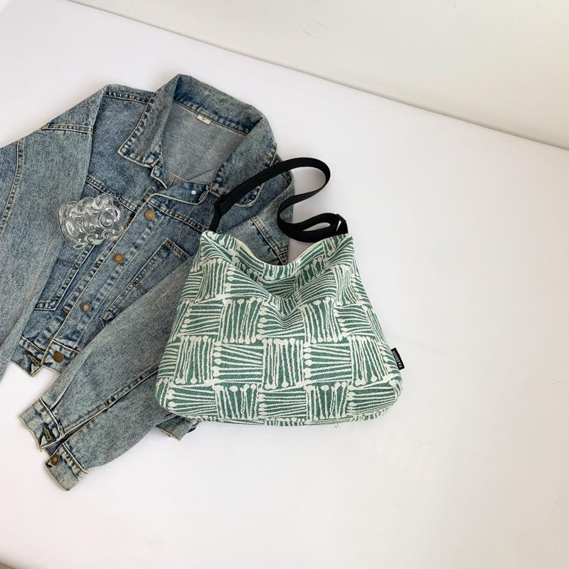 Тканевая сумка 2025 осень новая большая вместимость холст высокая ценность клетка широкий плечевой ремень одно плечо мессенджер сумка-тоут