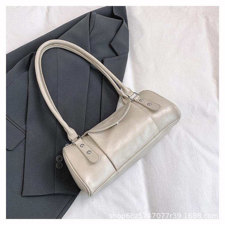 Retro high-end hand-held bowling bag women's 2025 new simple and fashionable shoulder bag versatile commuter messenger bag