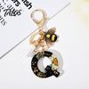 Talos Black Series Keychain Pendant, Dried Flower Initial Letter Charm Key Chain with Bee Tassel Design, A-Z Holder for Bag Purse Backpack