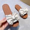 2024Крутые тапочки для женщин, носящих летние универсальные пляжные туфли с бантом и подошвой из сухожилий с плоской подошвой и нескользящие шлепанцы