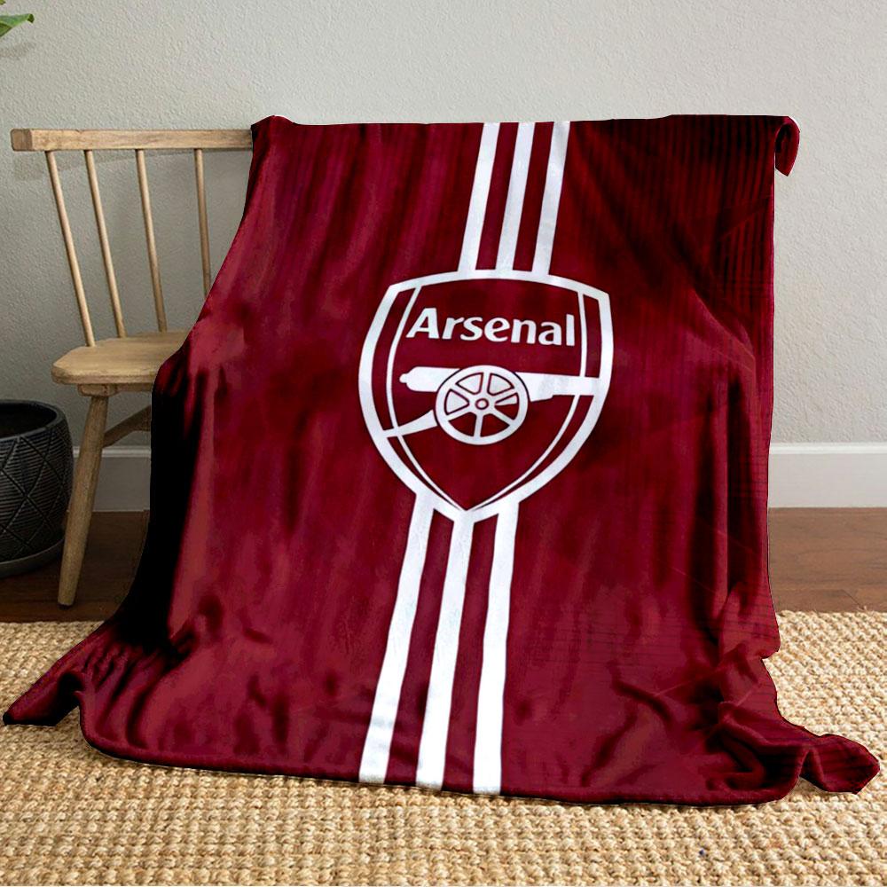 A red background with an Arsenal logo and vertical white stripes. for all seasons blanket lunch break throw gift