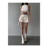 Женская кремовая мини-юбка со складками и шортами с поясом