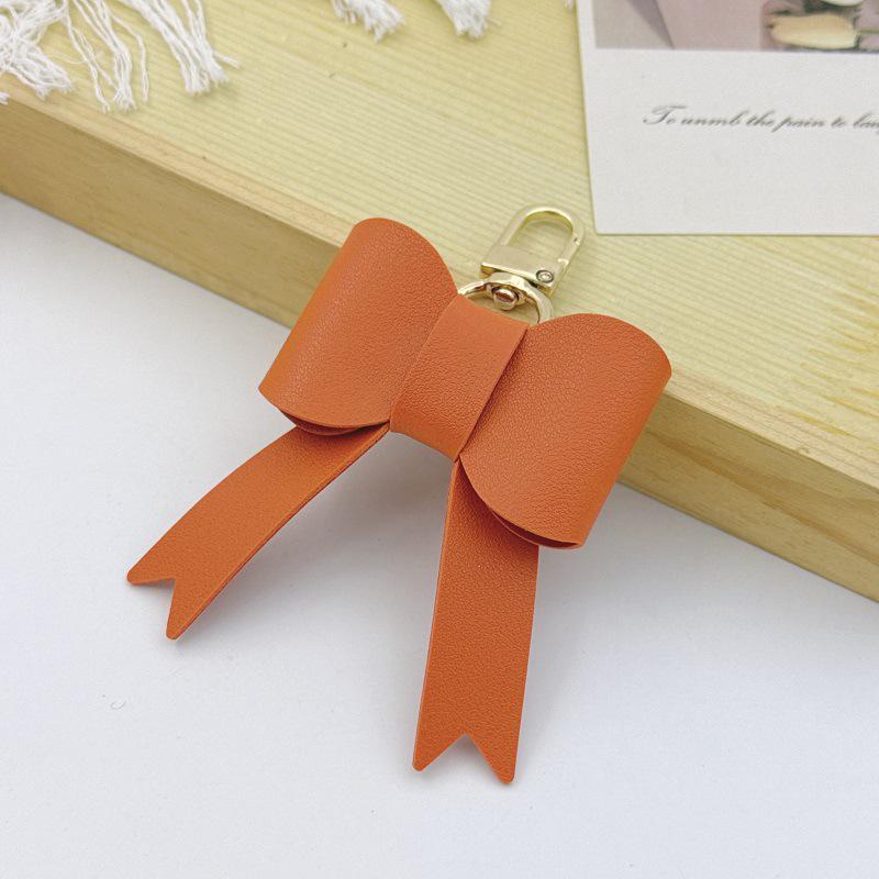 В наличии Брелок-подвеска на сумку в виде банта Милый кожаный брелок