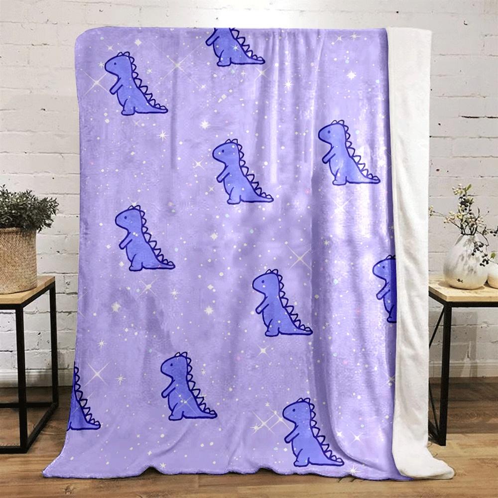 Cute purple dinosaurs scattered on a sparkly, pastel purple background. for all seasons blanket lunch break throw gift