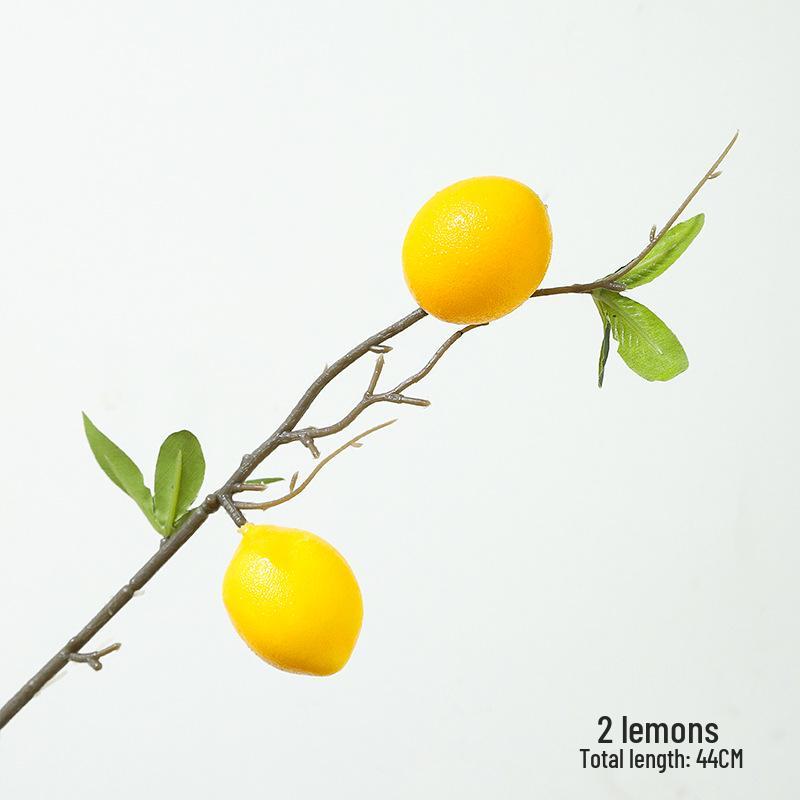 New Year Floral Arrangement with Golden Eucalyptus, Fan Leaf, Simulated Holly, Ginkgo, and Golden Leaf.