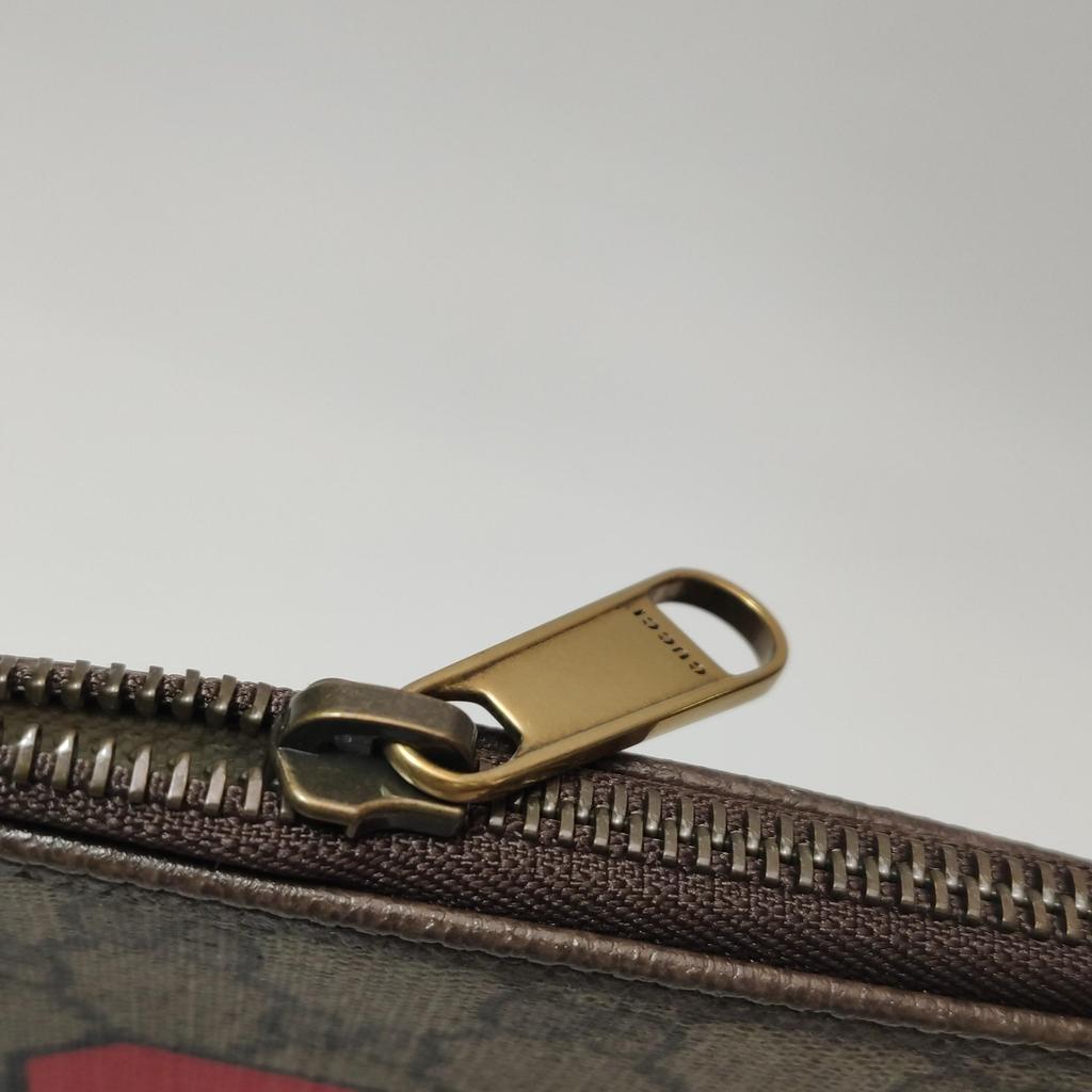 [Pre-Owned] Monogram Logo Letter Print Striped Wristband Canvas And Leather Clutch - Very Good #DBV4NS