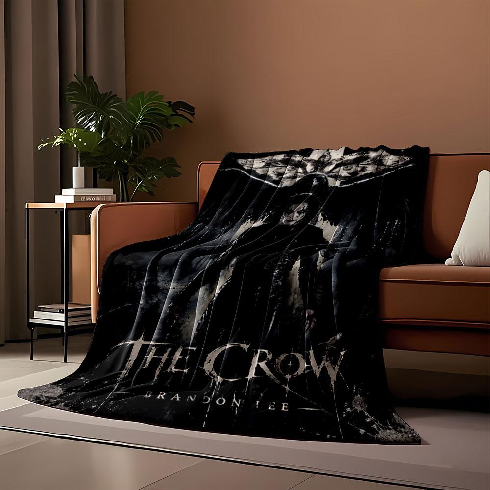 Dark gothic figure with smeared white face and outstretched crow wings. for all seasons blanket lunch break throw gift
