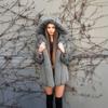 European and American fur jacket women's hooded thickened environmentally friendly mink fur jacket medium and long solid color coat
