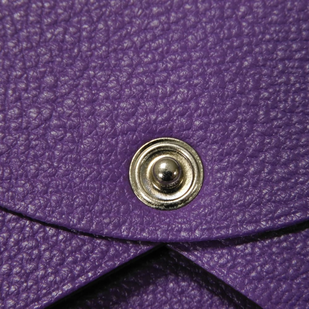 Used 9212 Calvi 7946 Chevre Mysore goatskin bag with gold-stamped logo and purple snap buttons. Excellent condition.